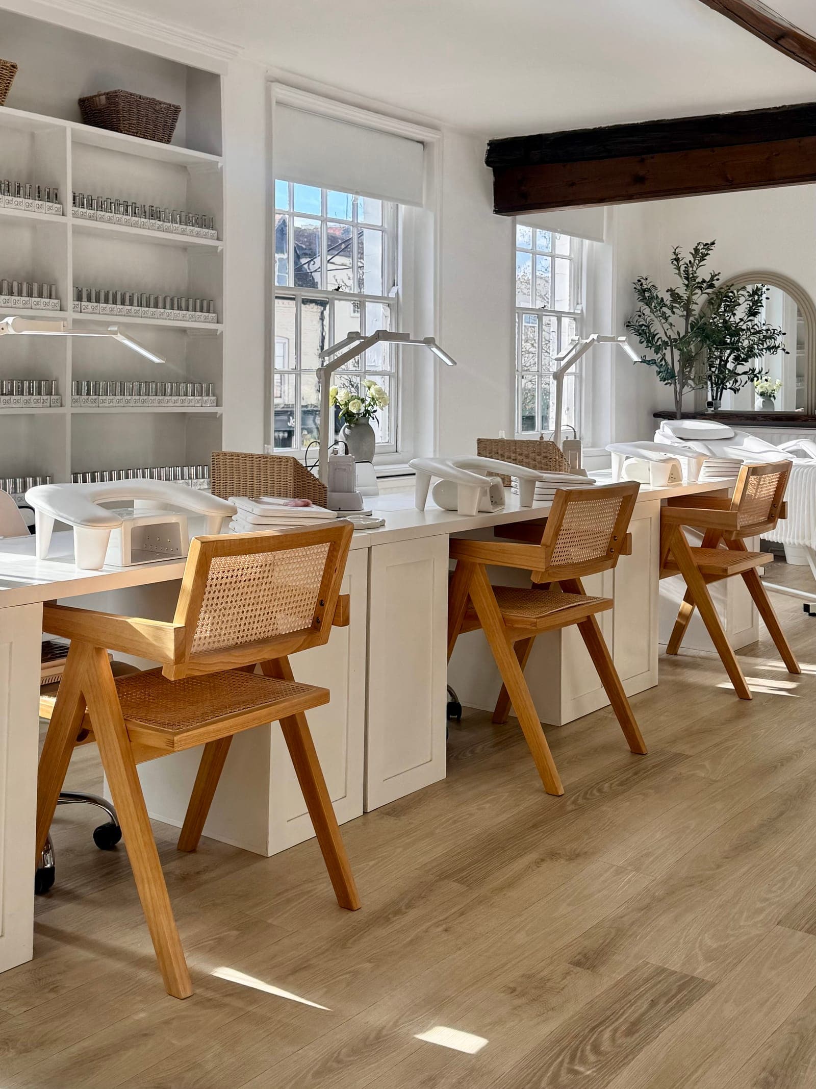 Inside the CREATE studio — sunlit training desks with cane chairs